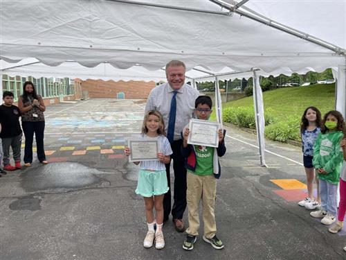 Students Holding Certificate